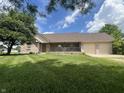 Charming single-story brick home with a covered front porch and an attached two-car garage at 1082 E County Road 400 S, Clayton, IN 46118
