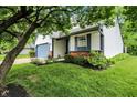 Charming single Gathering home featuring an attached garage and mature landscaping in a suburban neighborhood at 11518 Cherry Blossom W Dr, Fishers, IN 46038