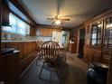 Inviting dining area with wood table, chairs, and natural light from the window at 1206 Lincoln St, Shelbyville, IN 46176