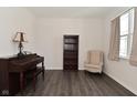 Bright living room features hardwood floors and a cozy reading nook by the window at 1351 Byron St, Greenfield, IN 46140