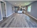 Spacious open-concept living room features hardwood flooring, recessed lighting, and an airy atmosphere at 1818 Broadway St, Anderson, IN 46012