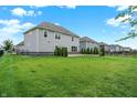 Expansive backyard featuring a lush lawn, offering ample space for outdoor activities and relaxation at 2074 Tompkins Dr, Westfield, IN 46074