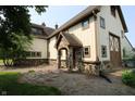 Charming exterior of home with stone accents and a covered entrance, nestled in a green yard at 2825 E 216Th St, Cicero, IN 46034