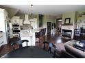 Spacious open concept living area with hardwood floors, fireplace, and natural light at 2825 E 216Th St, Cicero, IN 46034