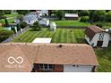 Aerial view of a home and backyard, with an outbuilding, pool, and lush greenery at 2914 E Blue Ridge Orch, Shelbyville, IN 46176