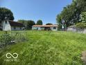 Large backyard with ample space for outdoor activities and gardening at 2914 E Blue Ridge Orch, Shelbyville, IN 46176