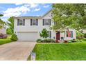 Attractive two-story home with a well-manicured lawn, garage, and 'Hello Spring' sign at 3637 Newberry Rd, Plainfield, IN 46168