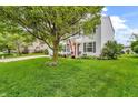Well-kept two-story home with a lush green lawn and mature trees providing shade at 3637 Newberry Rd, Plainfield, IN 46168