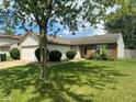 Well-maintained ranch style home with mature tree and landscaping at 39 Meadow Creek East Blvd, Whiteland, IN 46184