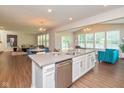 Modern kitchen featuring stainless appliances, quartz countertops, and an island with bar seating at 4642 Boyd Pl, Westfield, IN 46062