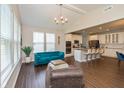 Bright living room features vaulted ceilings, large windows, and an open layout leading to the kitchen at 4642 Boyd Pl, Westfield, IN 46062