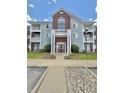 Charming condo building with brick and siding, featuring a well-maintained lawn and convenient parking at 5019 Amber Creek Pl, Indianapolis, IN 46237