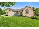 Beautiful brick home with lush green lawn and manicured landscaping at 5274 Brooks Bnd, Greenwood, IN 46143