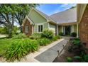 Inviting front entrance with beautiful landscaping and a walkway at 6118 Deerwood Dr, Greenwood, IN 46143