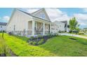 Charming single-Gathering home with a manicured lawn, porch and driveway at 7284 Bayview Run, McCordsville, IN 46055