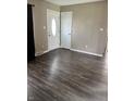 Bright living room featuring wood floors, neutral paint, and multiple entryways at 1108 Pierce Dr, Plainfield, IN 46168