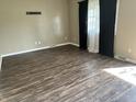 Spacious living room with newly installed wood flooring and plenty of natural light at 1108 Pierce Dr, Plainfield, IN 46168