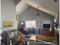 Open living room with high ceilings, large window, fireplace, neutral color scheme and plush furniture at 11632 Coastal Way, Indianapolis, IN 46229