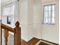A welcoming foyer featuring wood floors and a stairway at 11961 Driftstone Dr, Fishers, IN 46037