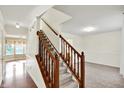 Carpeted staircase featuring wood railing at 11961 Driftstone Dr, Fishers, IN 46037