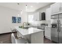 Modern kitchen features white cabinets, stainless steel appliances, and an island at 1217 Newman St, Indianapolis, IN 46201