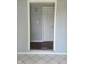 Entryway with white door, light gray walls, and a tile floor at 1601 S Biltmore Ave, Muncie, IN 47302