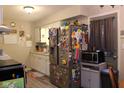 Functional kitchen features stainless steel appliances, white cabinetry, and ample counter space at 219 N 9Th Ave, Beech Grove, IN 46107