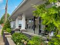 Inviting front porch with rocking chairs, lush landscaping, and a cozy atmosphere at 251 North St, Danville, IN 46122