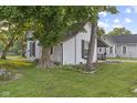 The side of a charming two-story home with a well-maintained lawn at 330 S Green St, Brownsburg, IN 46112