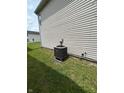 Side view showing outdoor AC unit and exterior design at 4264 Village Trace Dr, Indianapolis, IN 46254