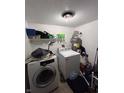 Functional laundry area equipped with washer and dryer, ready for convenience at 4264 Village Trace Dr, Indianapolis, IN 46254