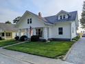 Charming two-story home with a welcoming front porch and well-maintained lawn at 4740 Milton St, Coatesville, IN 46121
