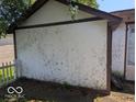 View of the side of a building featuring weathered paneling and trim at 489 W Sumner Ave, Martinsville, IN 46151
