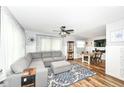 Spacious living area featuring neutral decor, a ceiling fan, and an adjacent dining space at 504 Broadway Ave, Arcadia, IN 46030