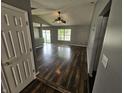 Bright and airy living room with beautiful wood floors, neutral walls, and plenty of natural light at 7307 Barnwell Pl, Indianapolis, IN 46217