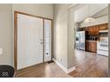 Bright foyer featuring an entrance leading to the kitchen with stainless steel appliances at 7831 Bayridge Dr, Indianapolis, IN 46236