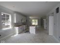 Spacious kitchen with white cabinets and large windows offers plenty of natural light at 9520 Bauhaus Way, Indianapolis, IN 46240