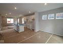 Bright kitchen features modern cabinets, an island with a sink, and recessed lighting at 9520 Bauhaus Way, Indianapolis, IN 46240