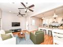 Open concept living area featuring a modern kitchen with stainless steel appliances at 1221 Cottage Ave, Indianapolis, IN 46203