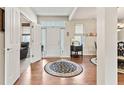 Bright foyer with hardwood floors, high ceilings, and a decorative rug, creating an inviting entrance at 13327 Hockley Dr, Fishers, IN 46037