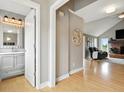 Hallway view of the living room featuring hardwood floors and a vaulted ceiling at 17138 Joliet Rd, Westfield, IN 46074