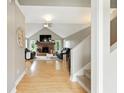 Bright living room with vaulted ceiling, brick fireplace, and hardwood floors at 17138 Joliet Rd, Westfield, IN 46074