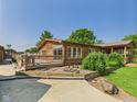 Charming log home with a deck, landscaped garden, and a cozy outdoor setting at 2895 E 600 S, Markleville, IN 46056