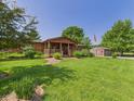Beautiful log home with a covered porch, mature trees, and an American flag at 2895 E 600 S, Markleville, IN 46056
