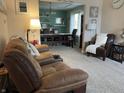 Comfortable living room provides ample seating and an open view into the dining area at 2925 Morgan Trl, Martinsville, IN 46151