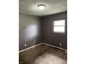 Modest bedroom featuring neutral carpet, a single window, and standard electrical outlets, ready for comfortable living at 3320 E 26Th St, Indianapolis, IN 46218