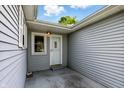 An exterior view featuring the entrance to the home, and light blue siding at 409 Hanley St, Plainfield, IN 46168