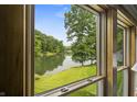 Enjoy picturesque lake views from the window of this stunning property, surrounded by lush trees and greenery at 4126 E Rembrandt Dr, Martinsville, IN 46151
