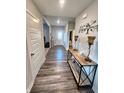 Inviting entryway with wood floors, console table, and decor, leading to other areas of the home at 4216 Lauder Rd, Bargersville, IN 46106