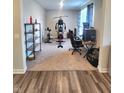 Versatile home gym with exercise equipment, desk space, and storage shelves, offering a fitness area at 4216 Lauder Rd, Bargersville, IN 46106